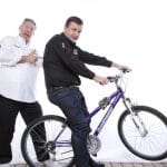 Mike Sexton pushes Tony G on his bike